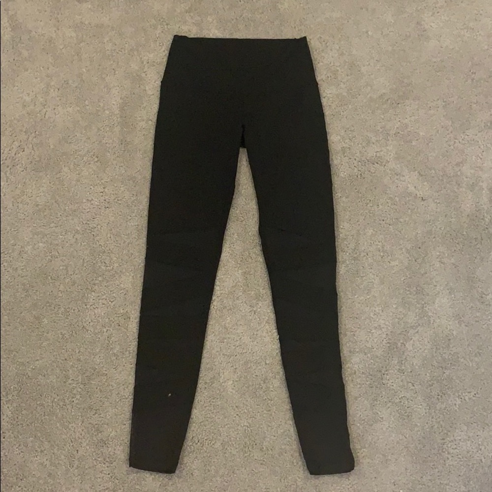 Black leggings with mesh detail on front.
